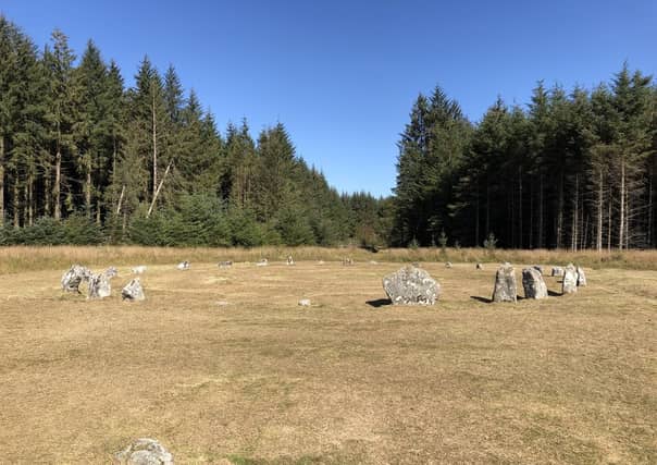 Stone Circle in Fernworthy Forest Looking towards the Stone Circle from the nearby Stone Row © Copyright Chris Thomas-Atkin