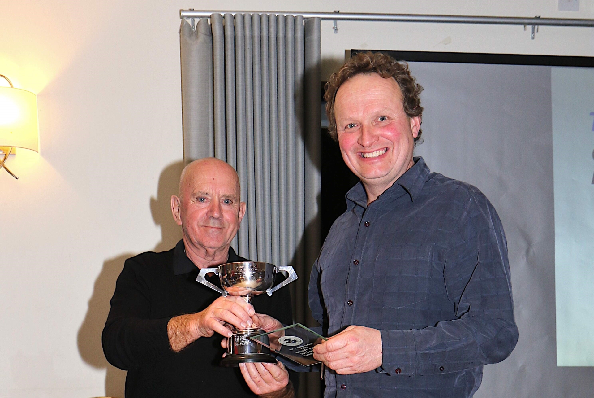 Simon Ashley receiving the Battery Maintenance Cup from Paul Morris (c)