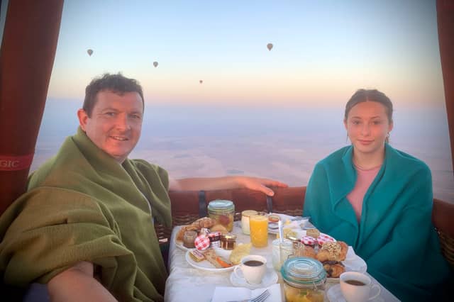 Michael Hollinson and daughter Darcy in a hot air balloon over North Africa