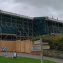 The scaffolding covering the thatched cottages at Drewsteignton which are due to be rebuilt after a fire
