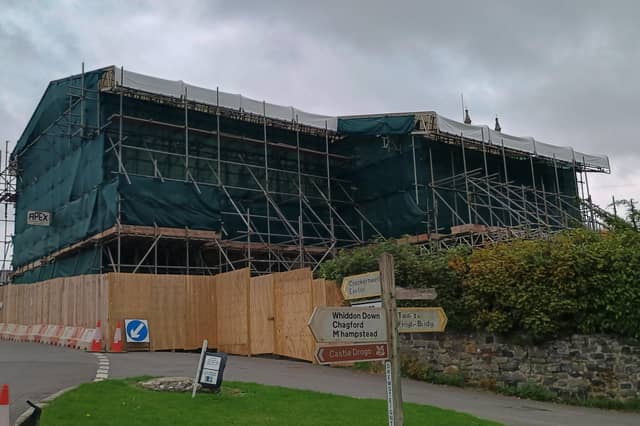 The scaffolding covering the thatched cottages at Drewsteignton which are due to be rebuilt after a fire