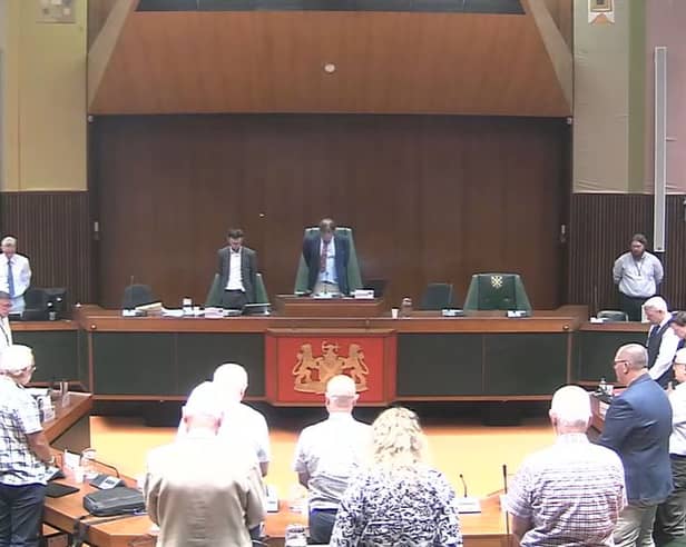 Members of the Devon and Cornwall Police and Crime Panel stand in silence to remember Ann Widdecombe