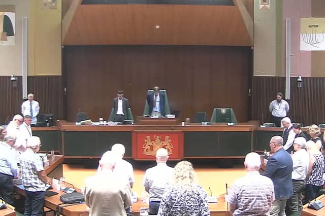 Members of the Devon and Cornwall Police and Crime Panel stand in silence to remember Ann Widdecombe