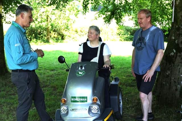 Information Adviser Simon Van-Orden talks with people making use of Bowerman the Tramper