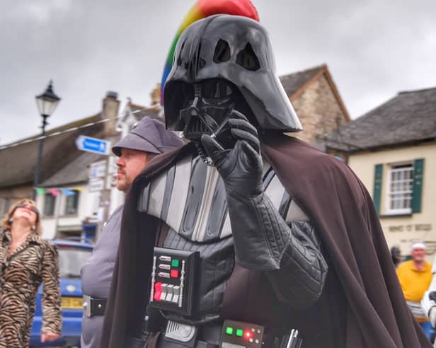 Darth Vader and Stormtroopers marching through the town during festival festivities
