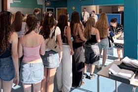 Students lineup waiting to collect their results