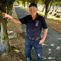 Roger in the avenue of hornbeam trees he planted in the cemetery