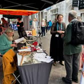 Museum Curator Joanna Eccles talks with passers-by
