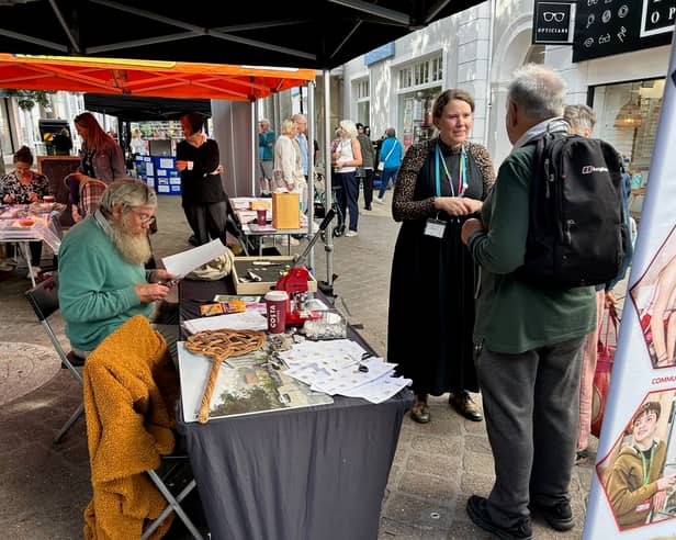Museum Curator Joanna Eccles talks with passers-by
