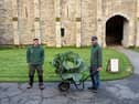 Sam (holding wheelbarrow) and Ryan, the garden team at Buckland Abbey with their 10kg cabbage