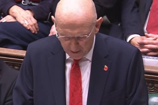 Chancellor John Healey delivering his Budget in Parliament