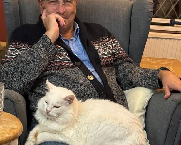 Martin Wrigley with his daughter's cat, Ignatius D Flufflesworth