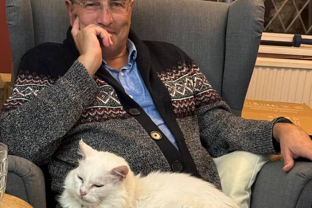 Martin Wrigley with his daughter's cat, Ignatius D Flufflesworth