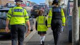 PCSOs joined children from St Andrew's school to hand out posters to dangerous drivers Credit- D&C Police