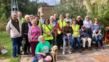 Photos of Debbie Hutchinson (in green T-shirt), some of her walking companions and her dog Aroha arriving at St Sidwell’s Centre in Exeter for a celebration cream tea 