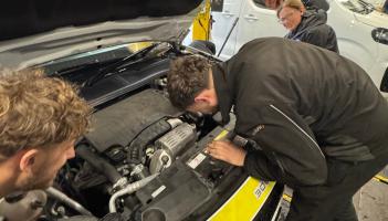Kwik Fit mechanics rescuing the kitten Credit- Plympton Police 