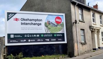 A new billboard to promote Okehampton Interchange station went up on East Street (Image credit- Nettl/Devon & Cornwall Rail Partnership)