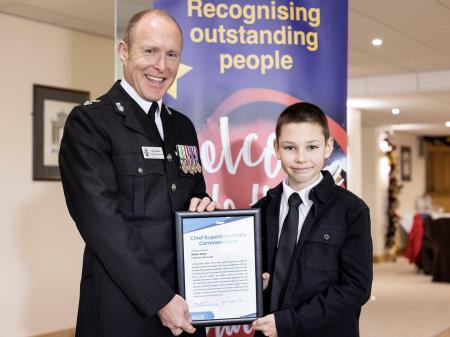 South Devon Police Commander Roy Linden presenting a commendation to Arthur Good (D&C Police)