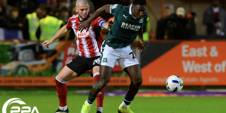 Aribim Pepple of Plymouth Argyle challenges for the ball with Pierce Sweeney of Exeter City during the Sky Bet League Match between Exeter City and Plymouth Argyle at St James Park, Devon on 23rd Oct 