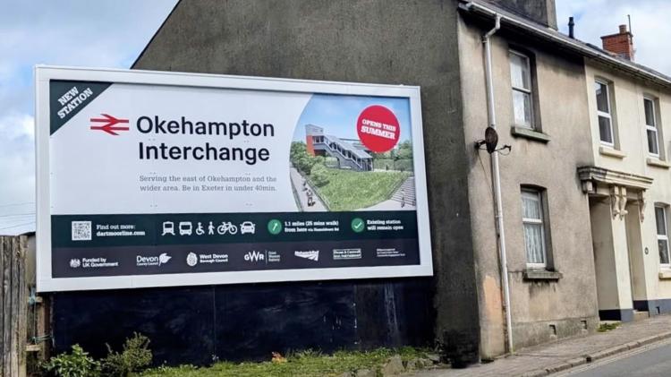 A new billboard to promote Okehampton Interchange station went up on East Street (Image credit- Nettl/Devon & Cornwall Rail Partnership)