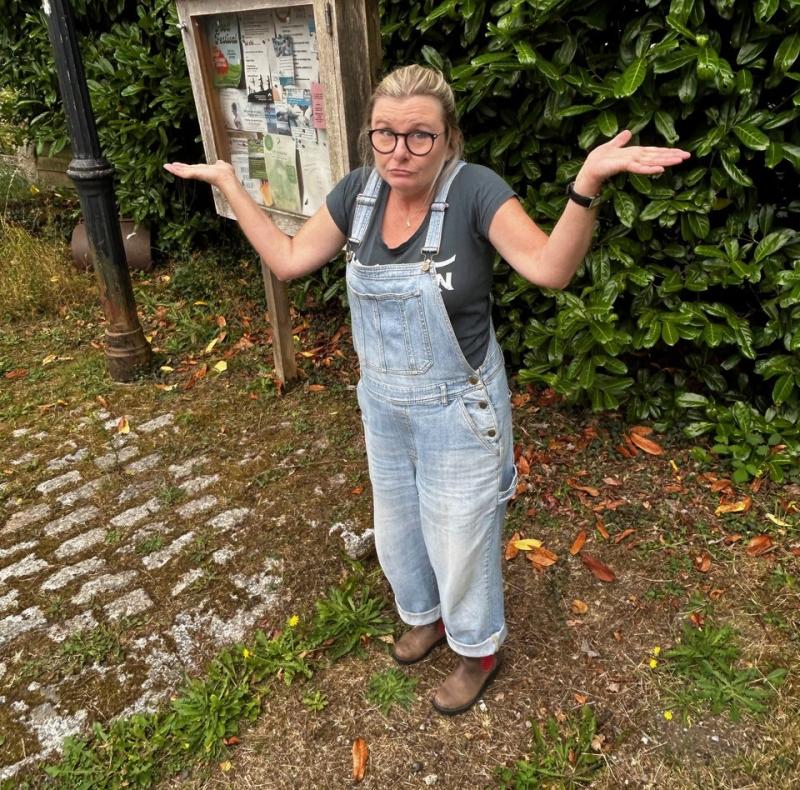 Villager Emma de la Fosse at the site where the box used to stand Credit: Emma de la Fosse