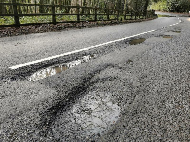 Potholes on a Devon road Credit- Lewis Clarke