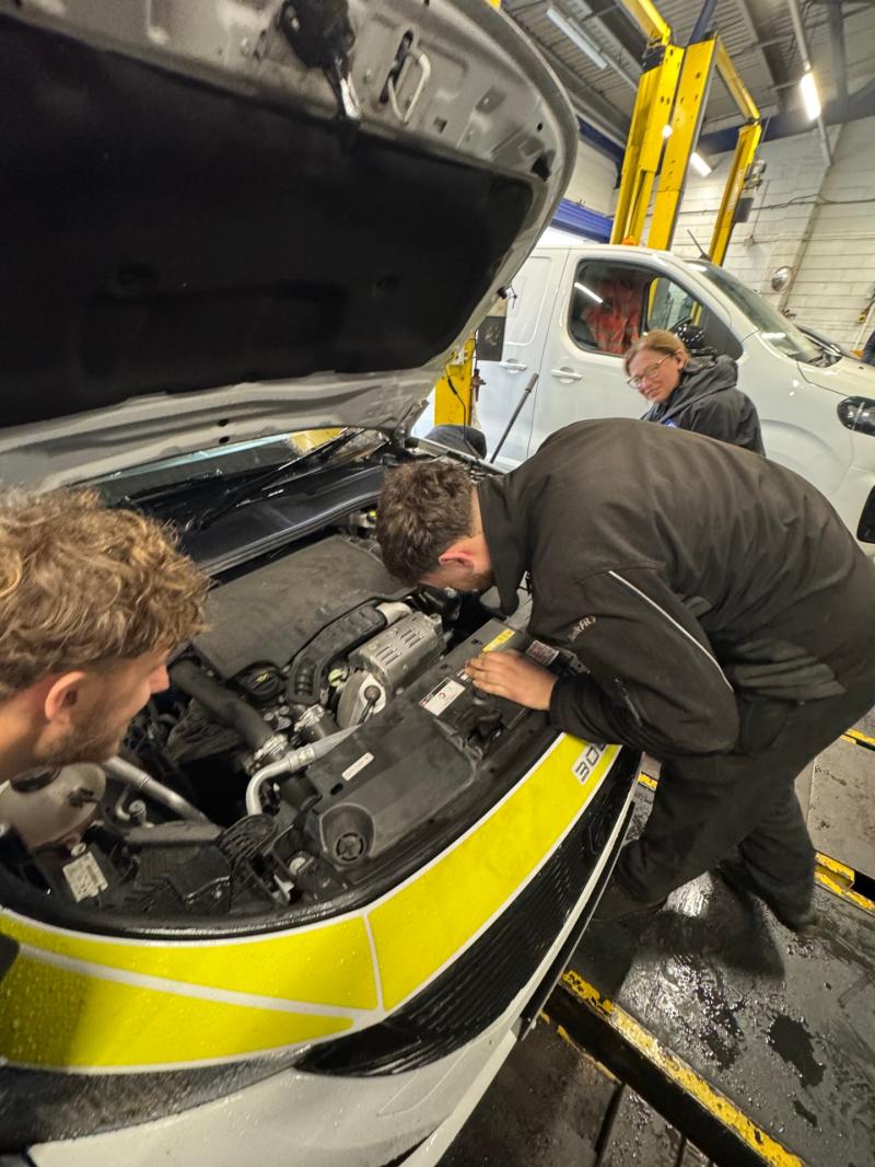 Kwik Fit mechanics rescuing the kitten Credit- Plympton Police 