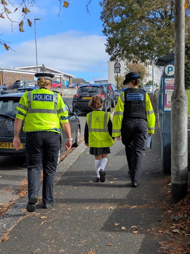PCSOs joined children from St Andrew's school to hand out posters to dangerous drivers Credit- D&C Police
