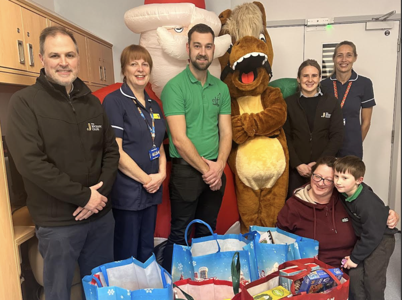 Pictured are Jack Parkinson, Louise Taylor, Gary Moore, Dexter, Hannah Lastead, Janine Roberts, Lottie Birchall and Freddie (age 5)