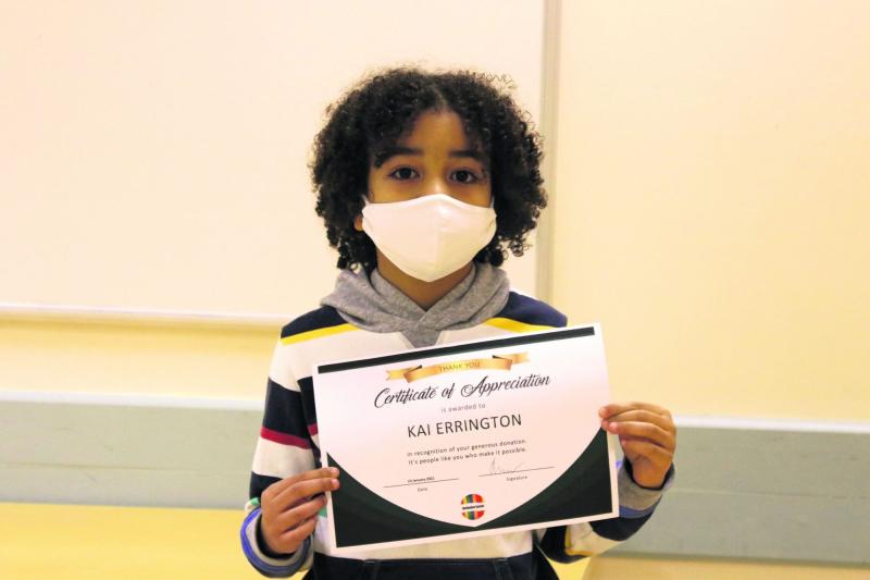 Young Kai donated his presents to less fortunate children